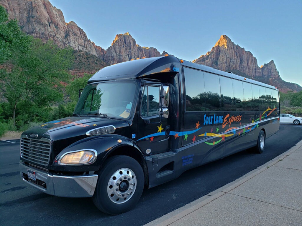 Bus driving through Zion National Park on a chartered tour.