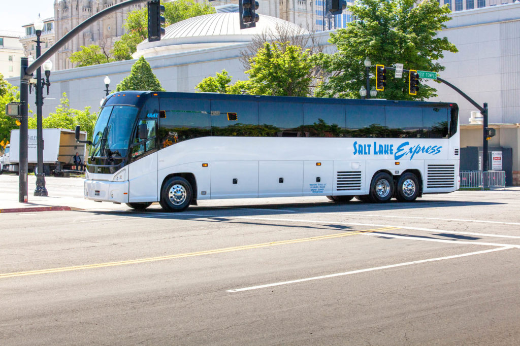 55 Passenger Bus driving through downtown Salt Lake City